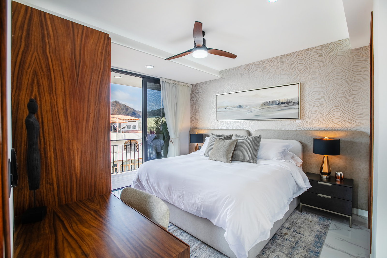 Calming bedroom with natural light and terrace access