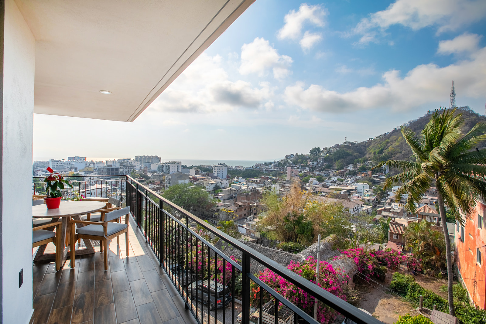 Open terrace with ocean, mountain and city views