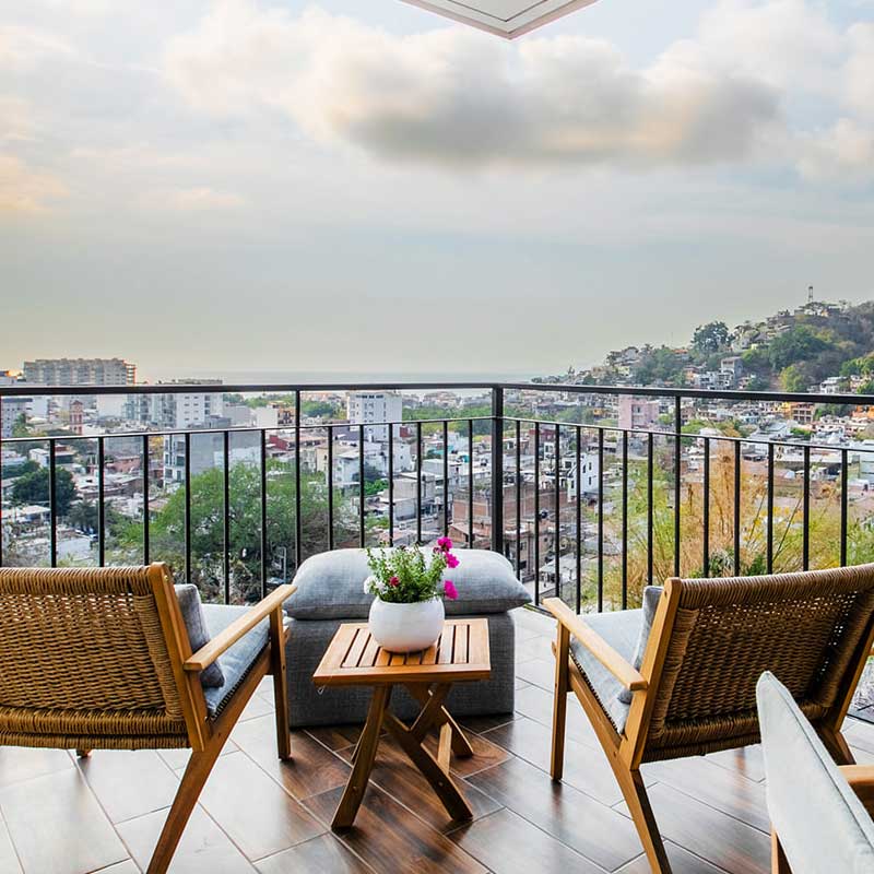 Terrace lounge seating with ocean backdrop